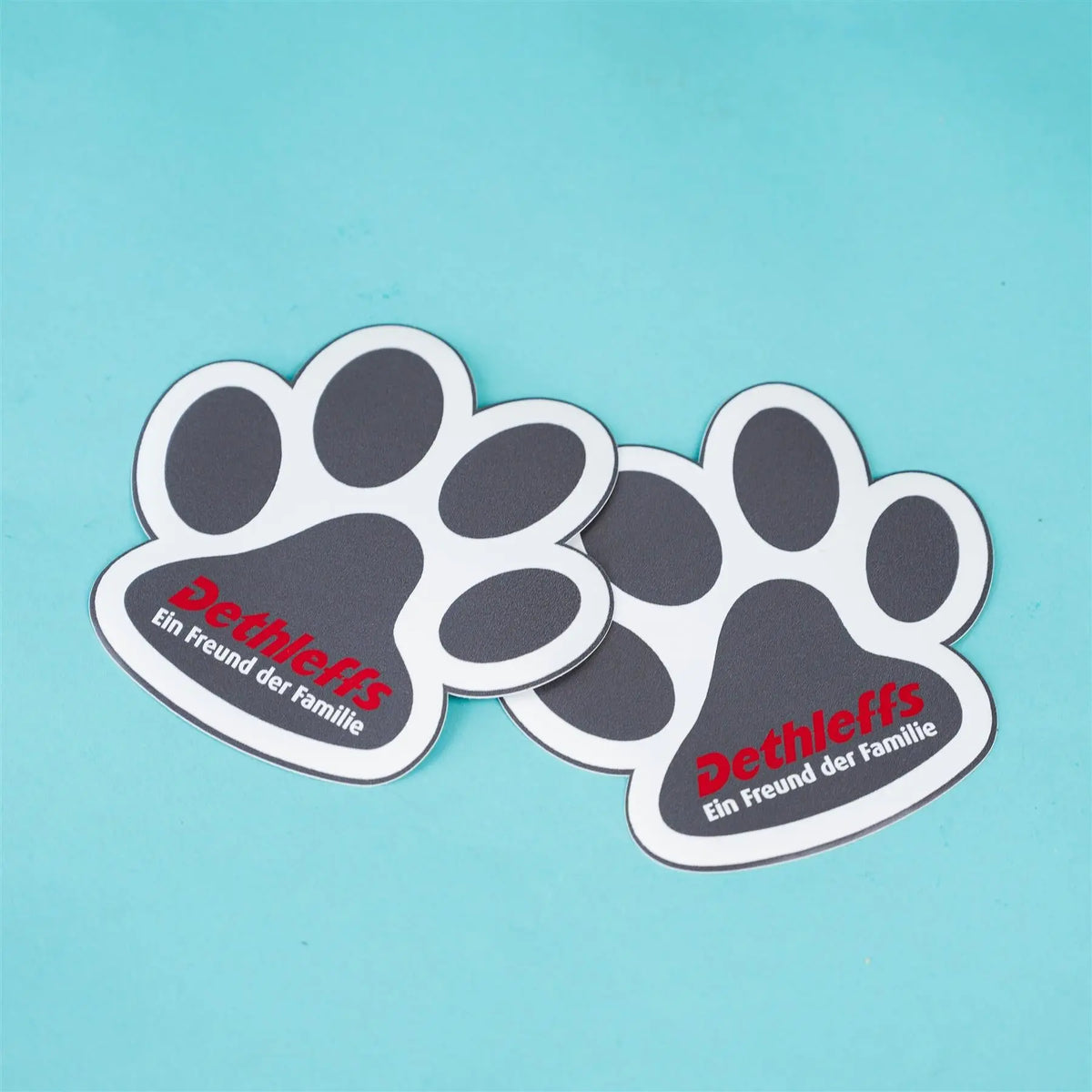 Two black pawprint Dethleffs motorhome vinyl decal stickers.