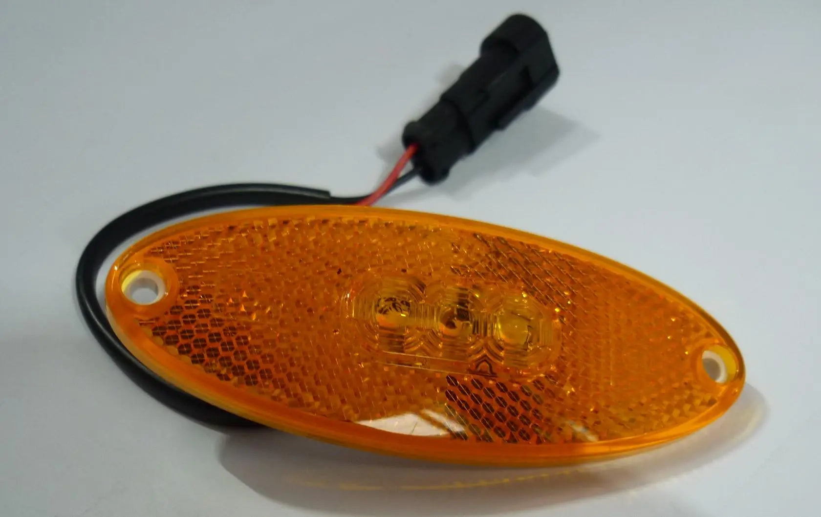 An amber Auto-Trail motorhome side marker light.