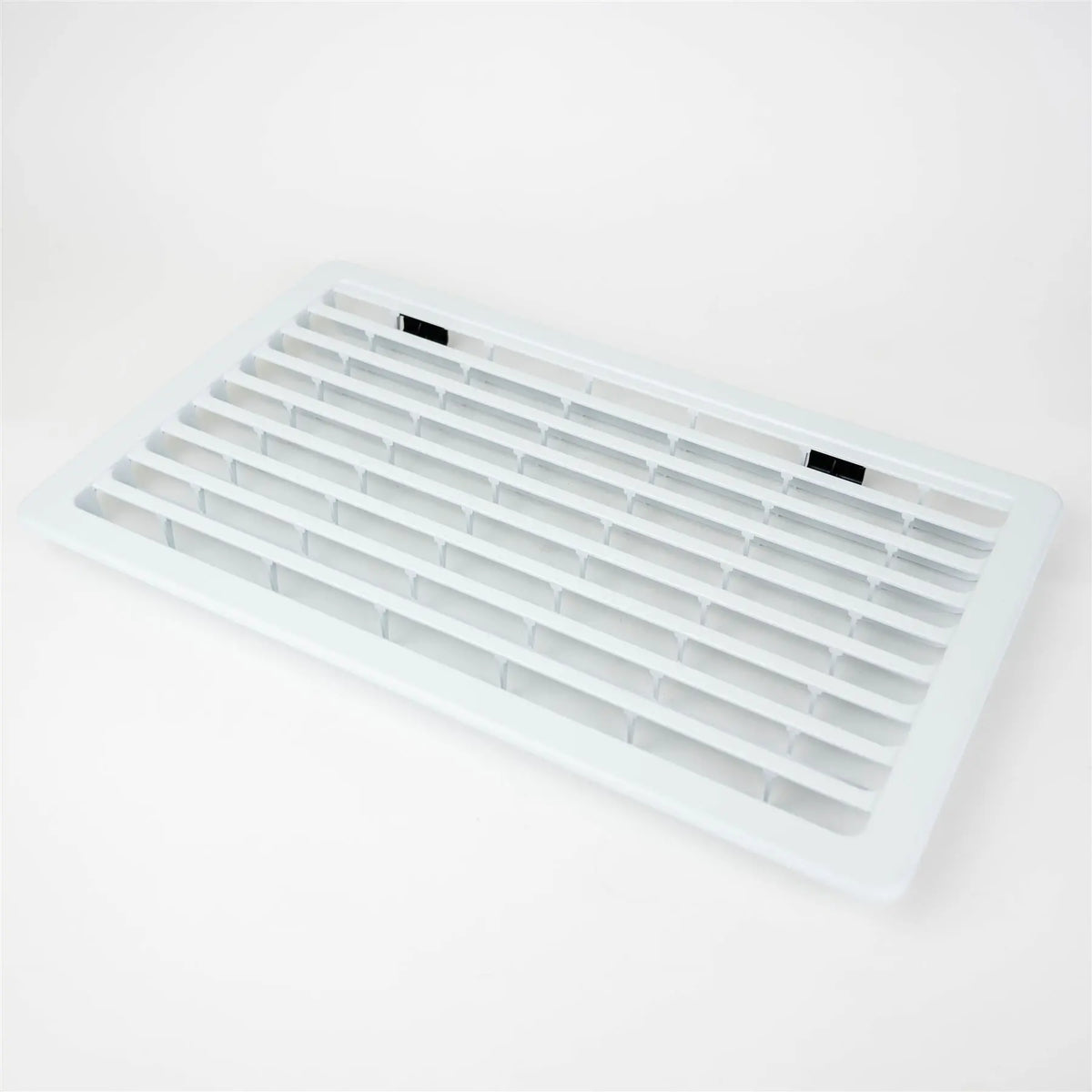 A white Dethleffs motorhome Thetford fridge ventilation grille.