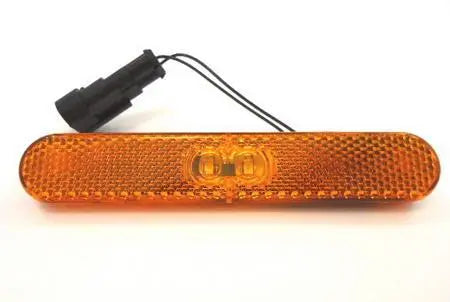 An amber Malibu motorhome side marker with seal connector.