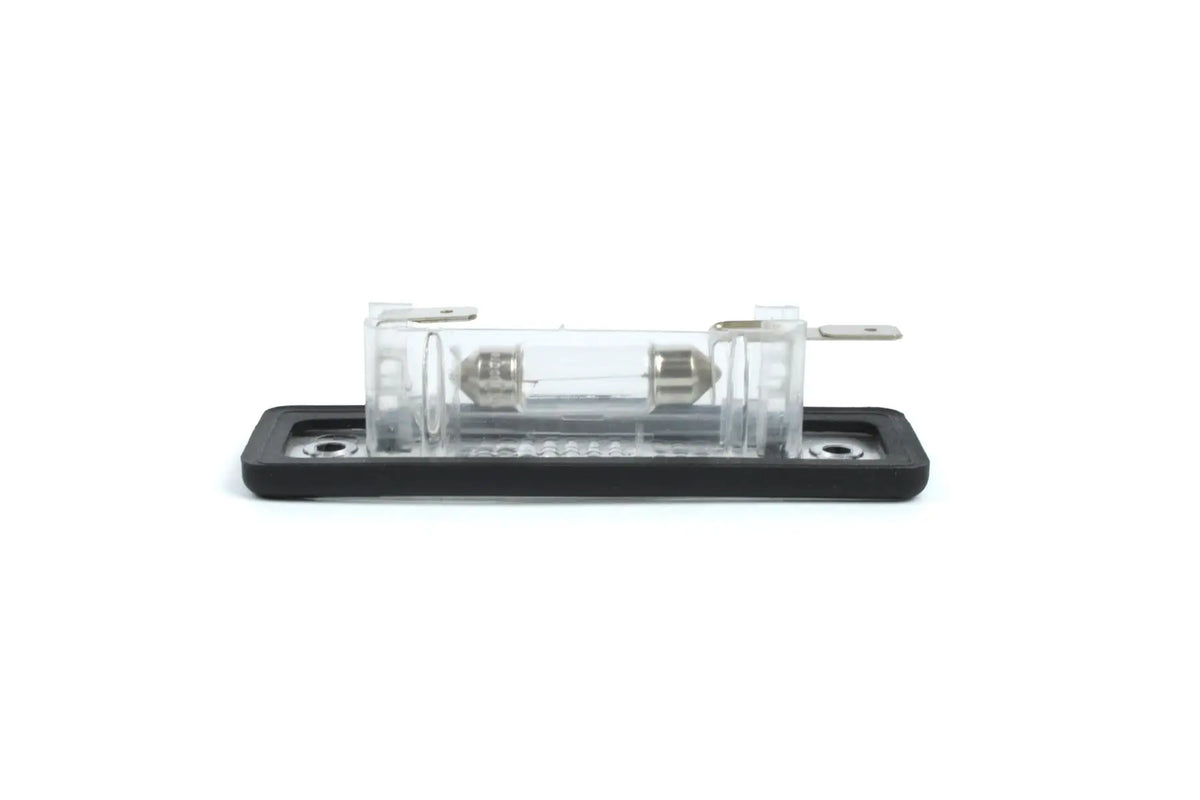 A clear Dethleffs motorhome rear number plate light with a black rim.