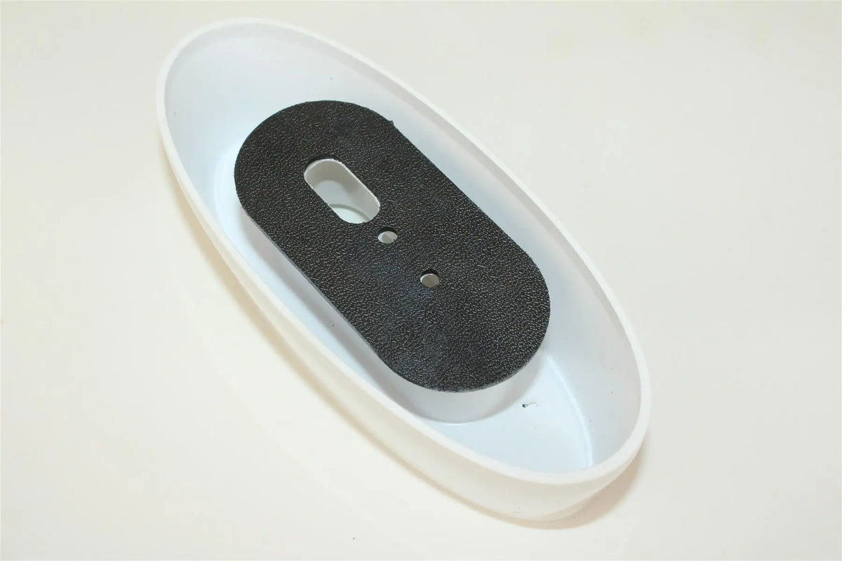 A white Roller Team motorhome end outline marker light.