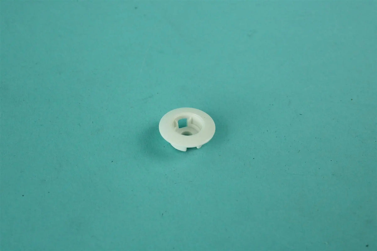 A white Roller Team motorhome decorative screw cap cover.