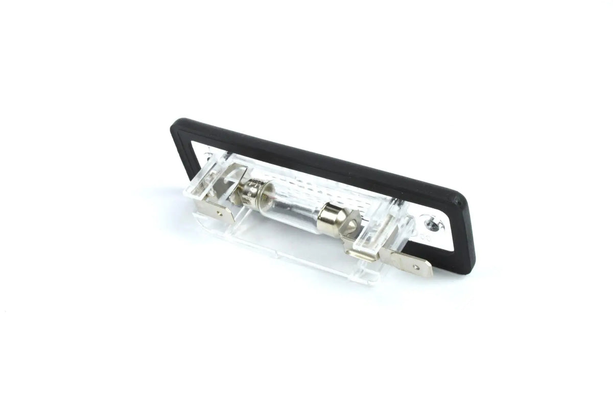 A clear Dethleffs motorhome rear number plate light with a black rim.
