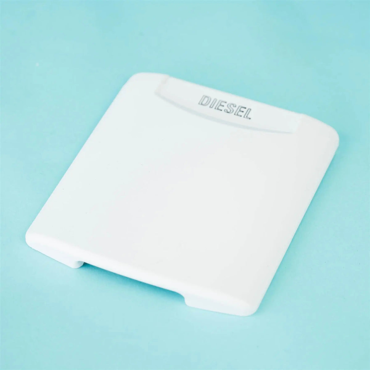 A white Dethleffs motorhome fuel cap cover.
