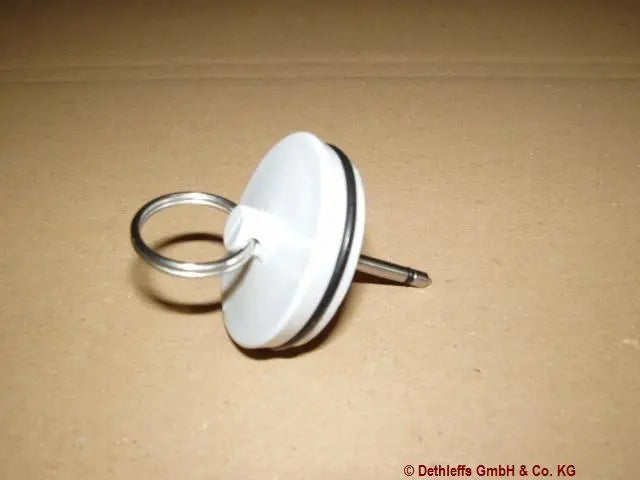 A white motorhome sink plug for Dethleffs and Reich.