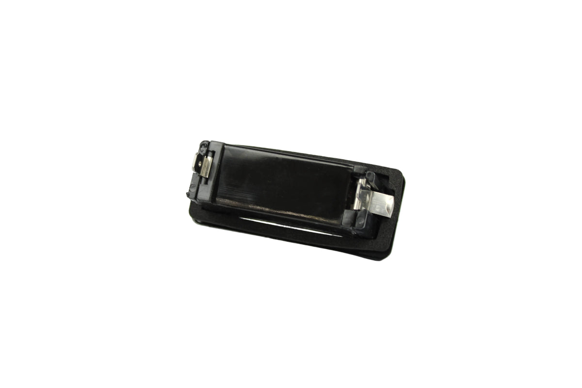 A black Roller Team motorhome number plate light.