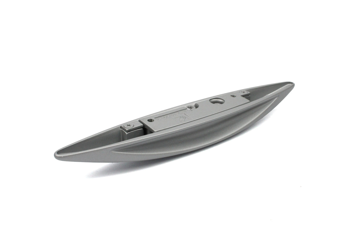 A silver wing-shaped Roller Team motorhome cupboard door handle.