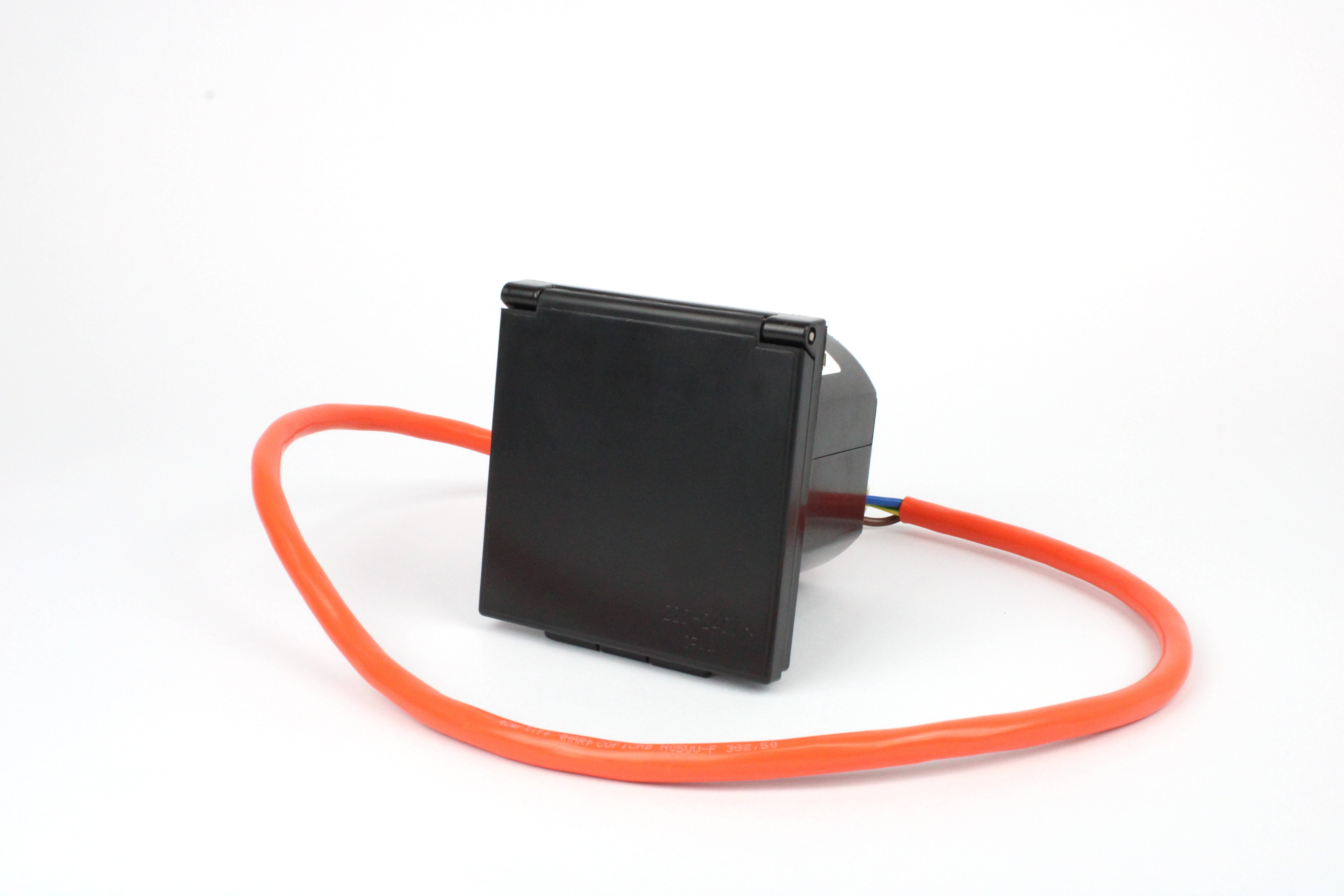 Black mains flush inlet with orange cable on a white background
