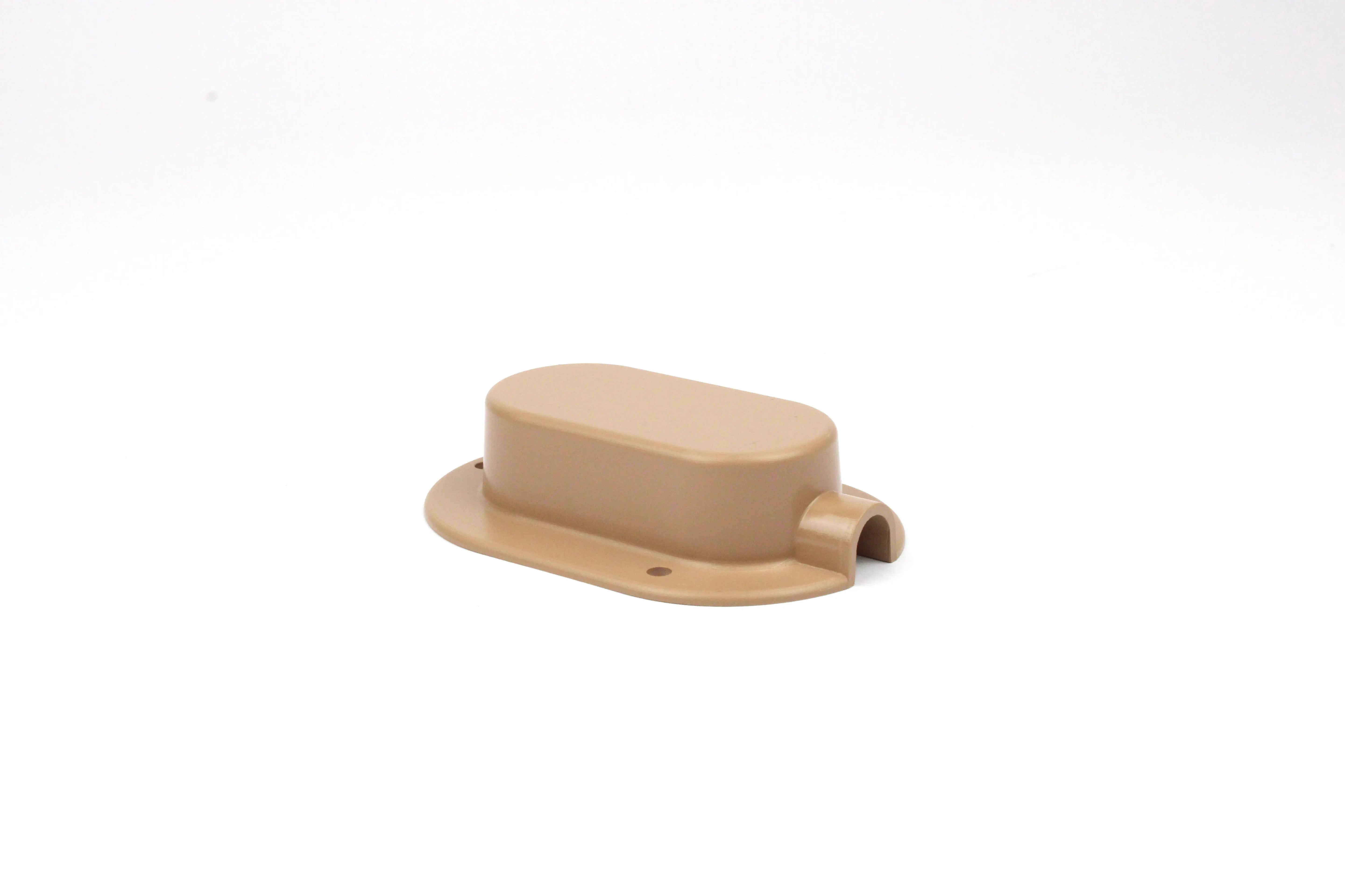 Beige cable entry cover on white background