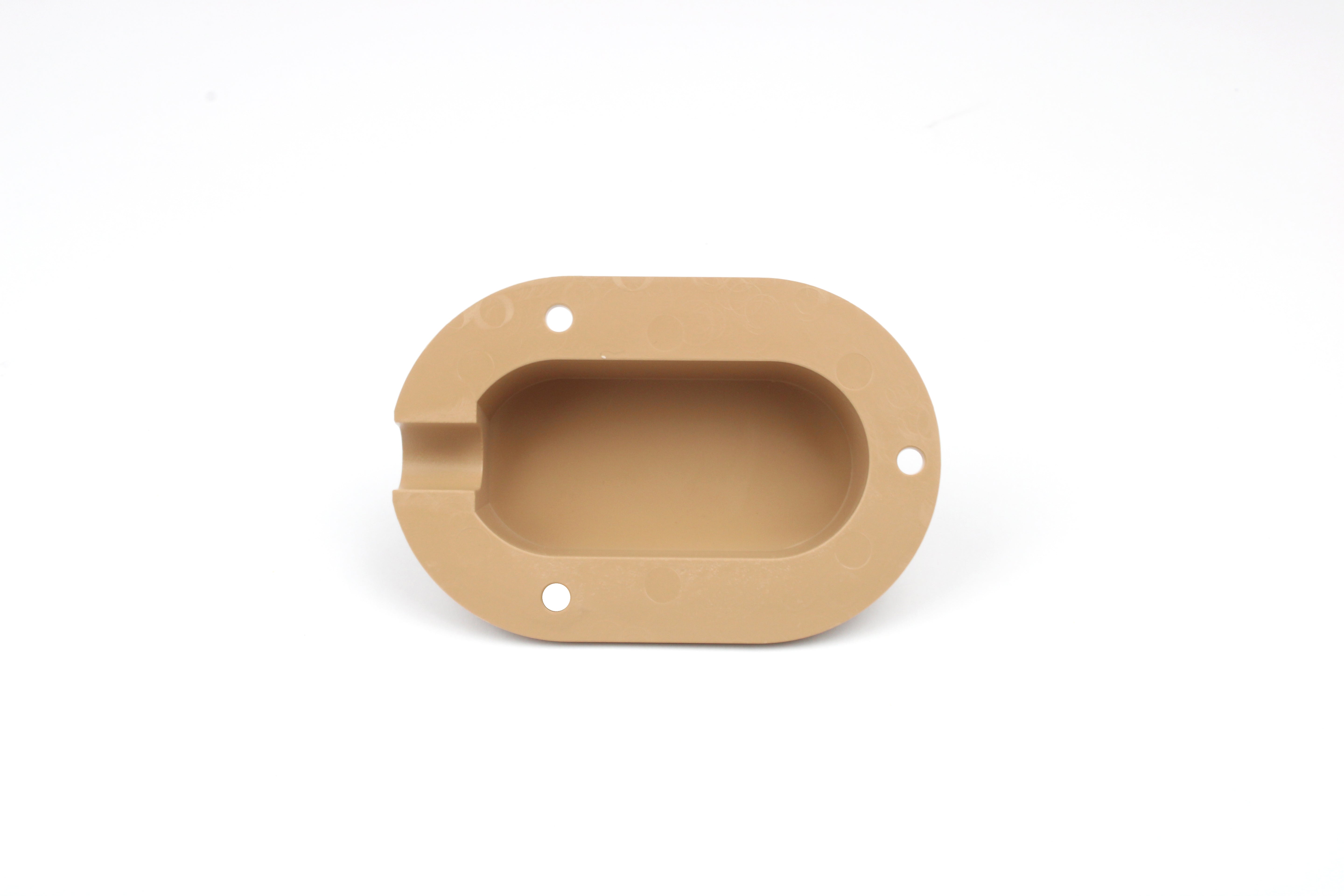 Beige cable entry cover on white background