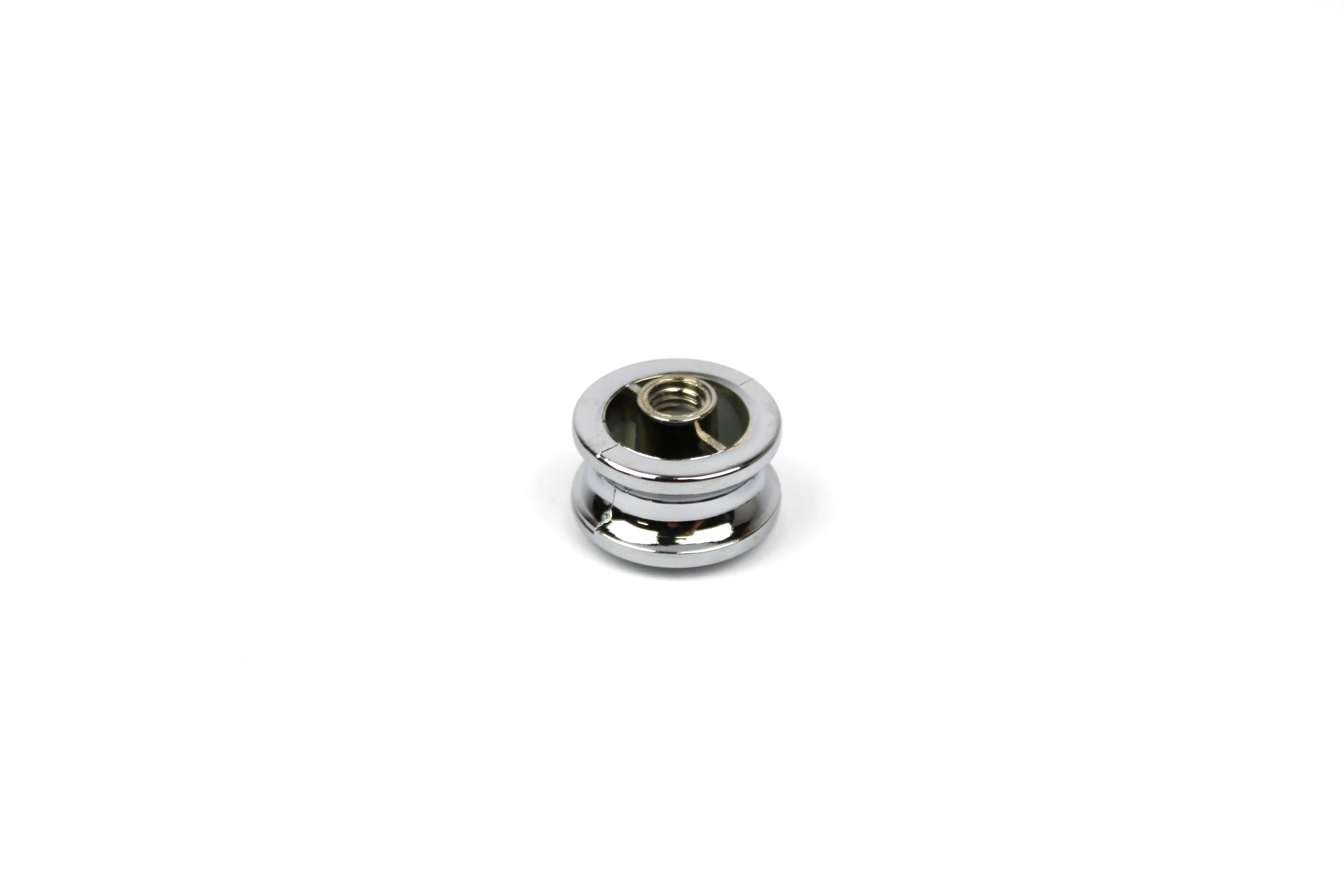 A chrome Auto-Trail motorhome push button knob.