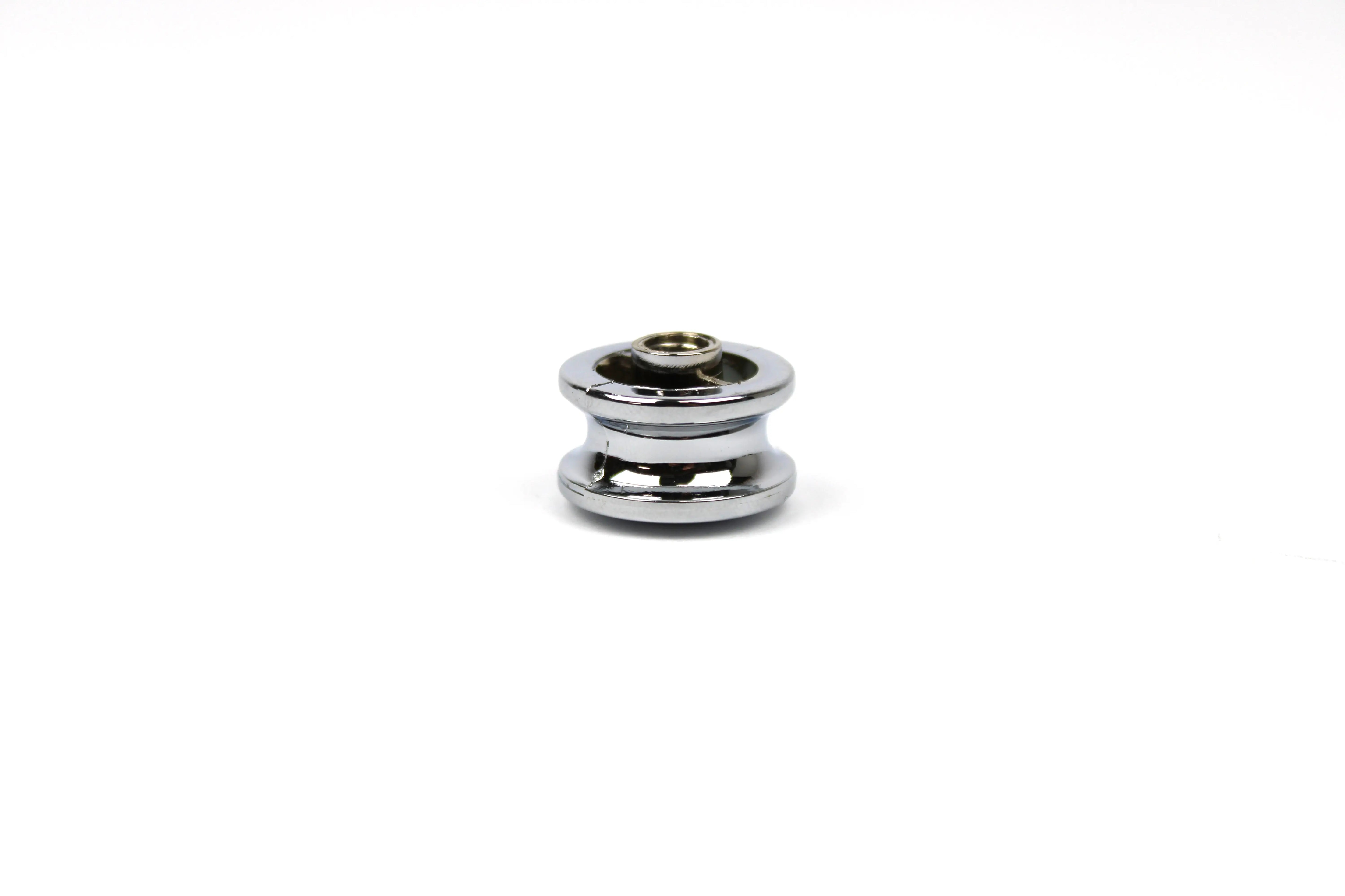 A chrome Auto-Trail motorhome push button knob.