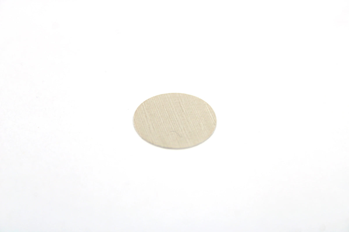 A sheet of casino pebble grey Dethleffs self-adhesive dot stickers on a beige backing.