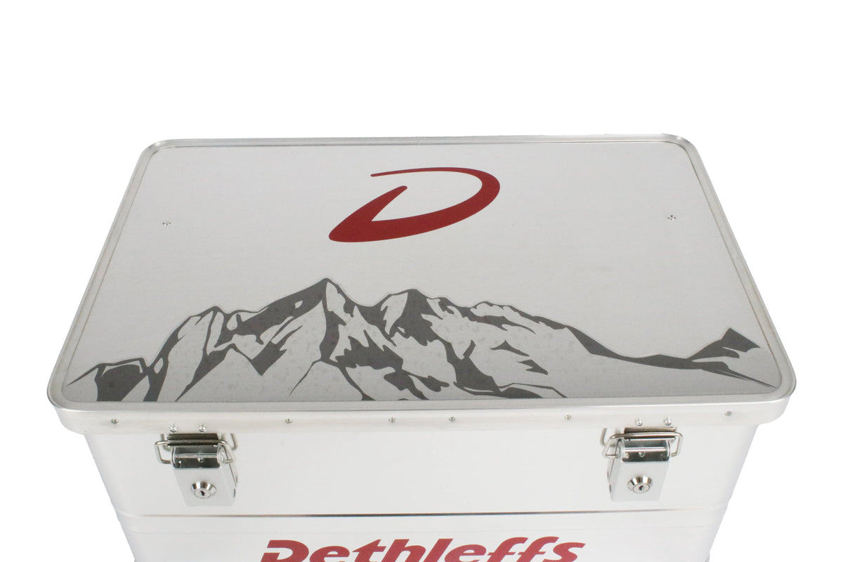 An aluminium Dethleffs motorhome storage box with branded stickers.
