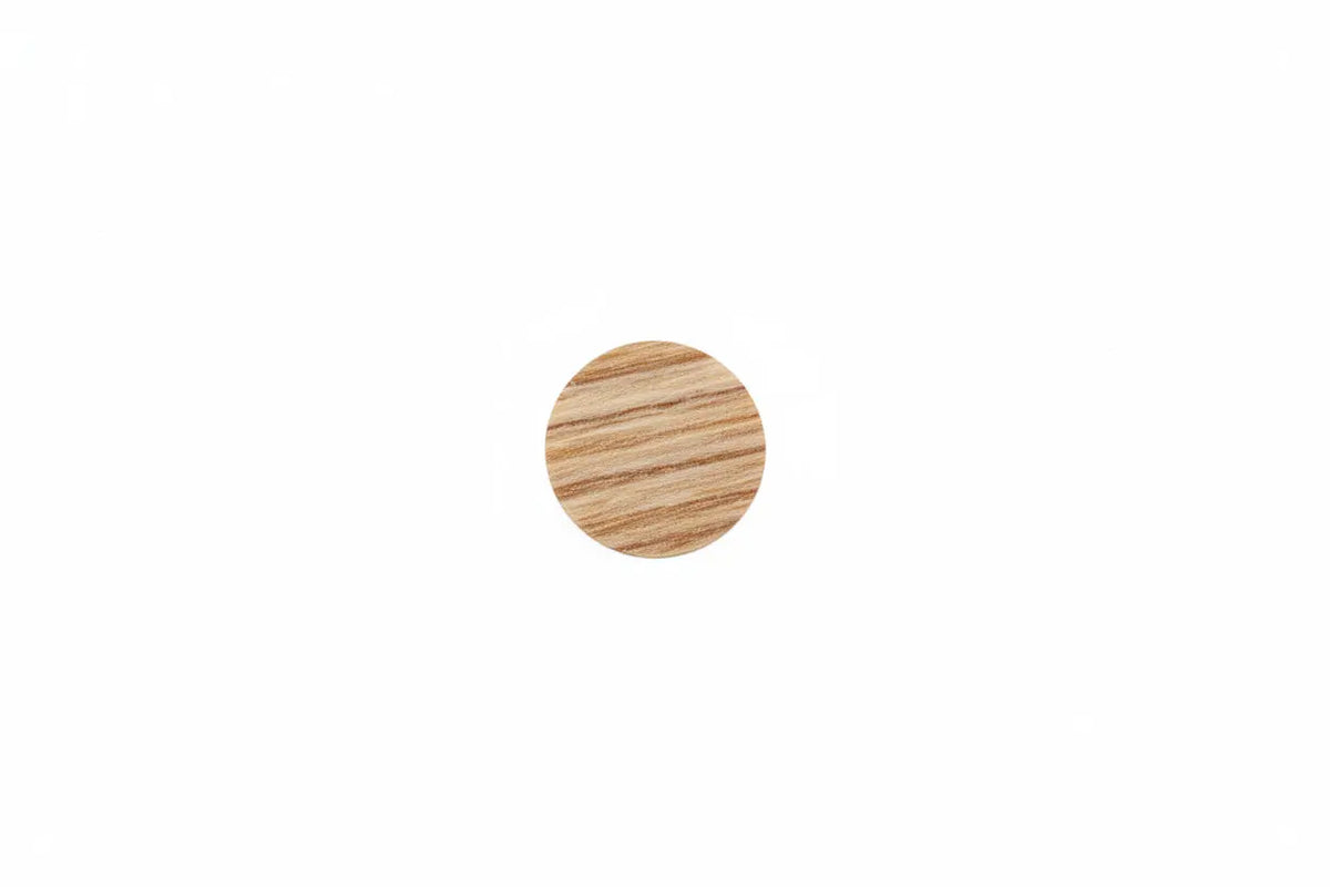 A sheet of rosario cherry Dethleffs self-adhesive dot stickers on a beige backing.