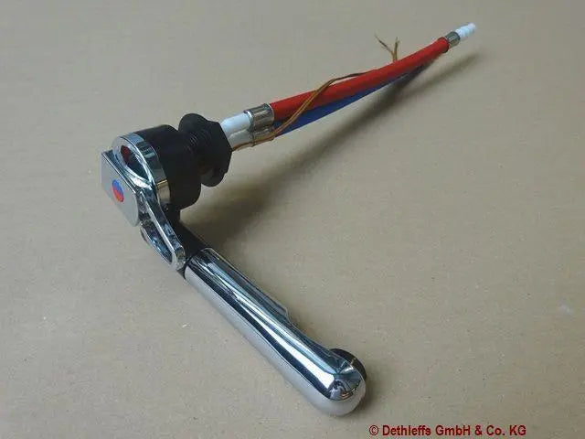A silver metal Sunlight and Dethleffs motorhome kitchen tap.
