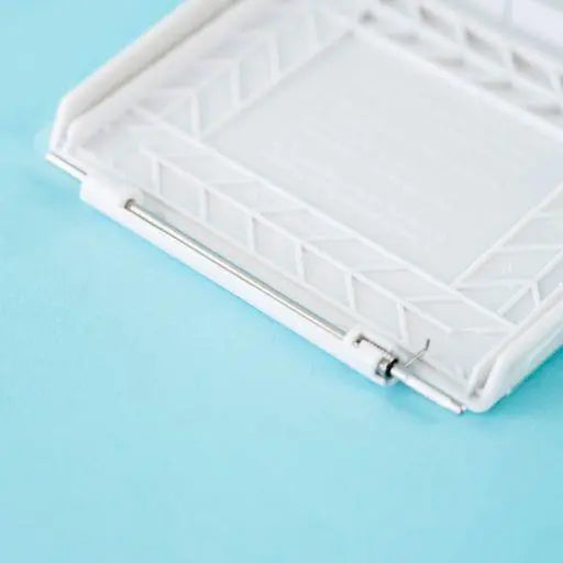A white Dethleffs motorhome external gas BBQ point cover.