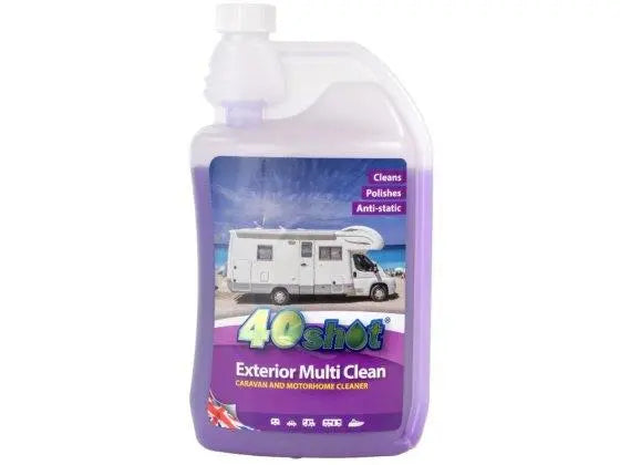 Purple cleaning fluid in a bottle on a white background