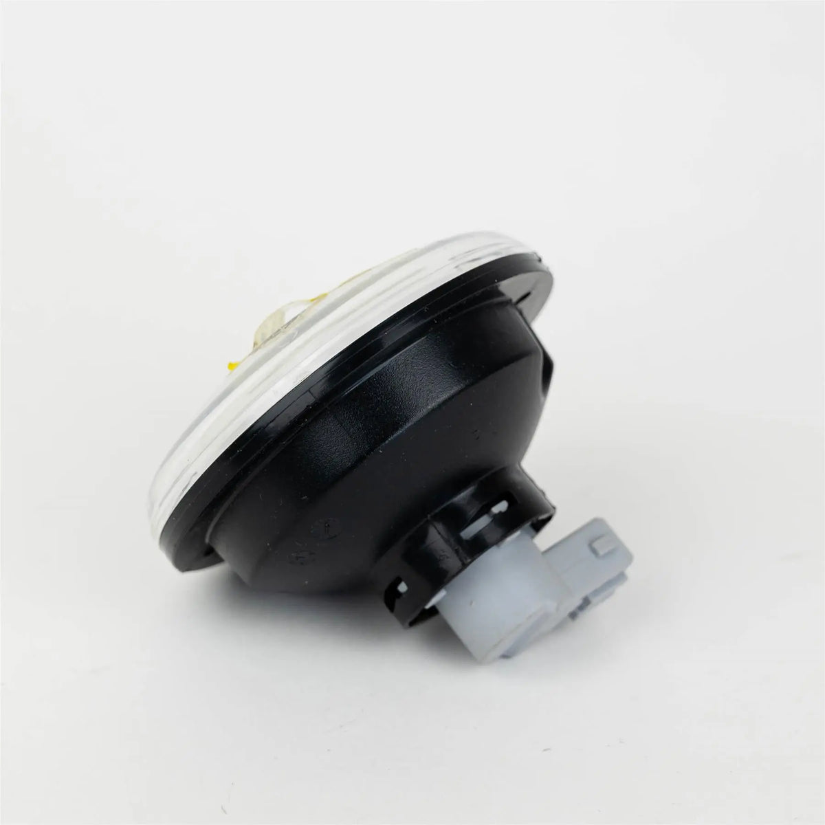 A Dethleffs motorhome reverse light with a transparent bulb.