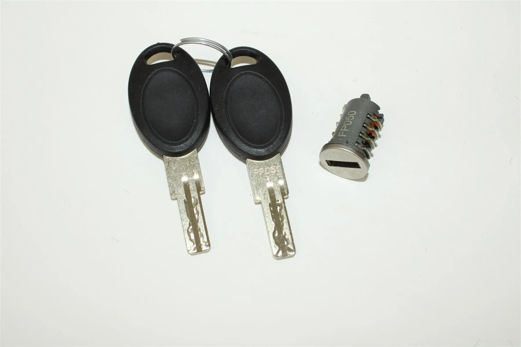 A Roller Team motorhome FAP lock barrel and two 050 keys.