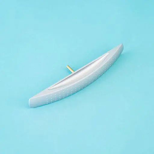A silver arch-shaped Roller Team motorhome cupboard door handle.