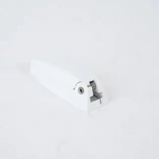 A white retainer catch for Roller Team and AutoTrail motorhomes.