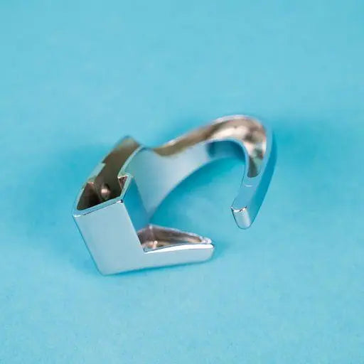 A silver Dethleffs D coat hook.