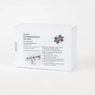 Three matte silver Sunlight motorhome storage hooks.