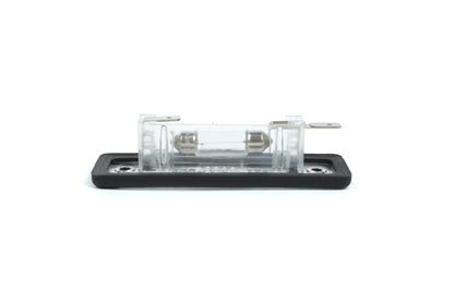 A clear Dethleffs motorhome rear number plate light with a black rim.
