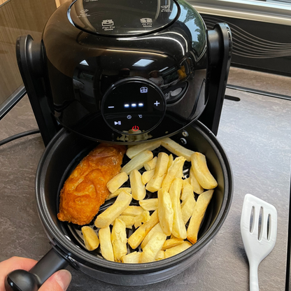 A black air fryer and hob.