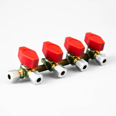 A red and white Dethleffs motorhome four-way Truma gas isolation valve.