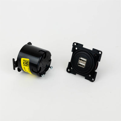 A black Dethleffs motorhome USB socket.