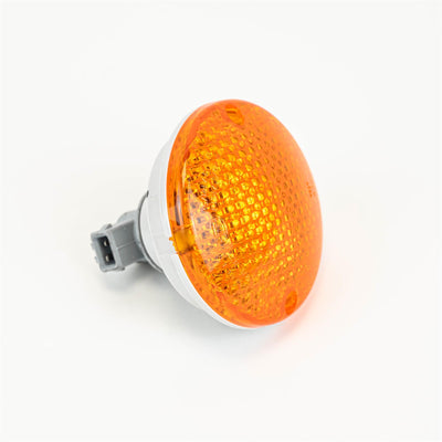 An orange Roller Team motorhome rear indicator light.