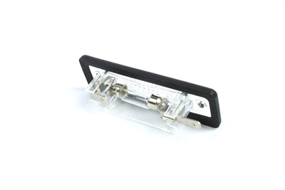 A clear Dethleffs motorhome rear number plate light with a black rim.