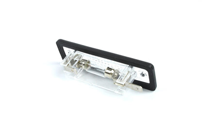 A clear Dethleffs motorhome rear number plate light with a black rim.
