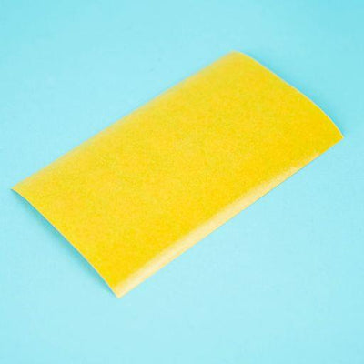 A sheet of topaz apfel / cypress villa Dethleffs self-adhesive dot stickers on a yellow backing.