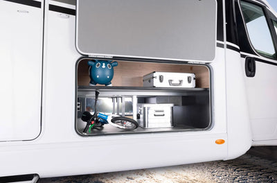 An aluminium Dethleffs motorhome storage box with branded stickers in a motorhome.