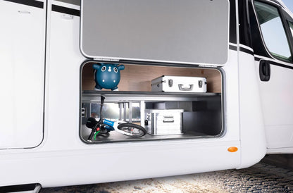 An aluminium Dethleffs motorhome storage box with branded stickers in a motorhome.