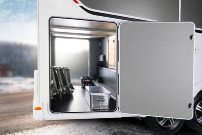 An aluminium Dethleffs motorhome storage box with branded stickers in a motorhome.