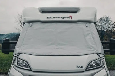 A Sunlight motorhome with a windscreen cover.