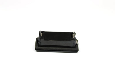 A black Roller Team motorhome number plate light.