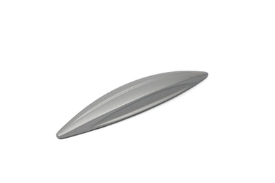 A silver wing-shaped Roller Team motorhome cupboard door handle.