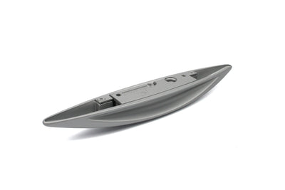 A silver wing-shaped Roller Team motorhome cupboard door handle.
