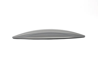 A silver wing-shaped Roller Team motorhome cupboard door handle.