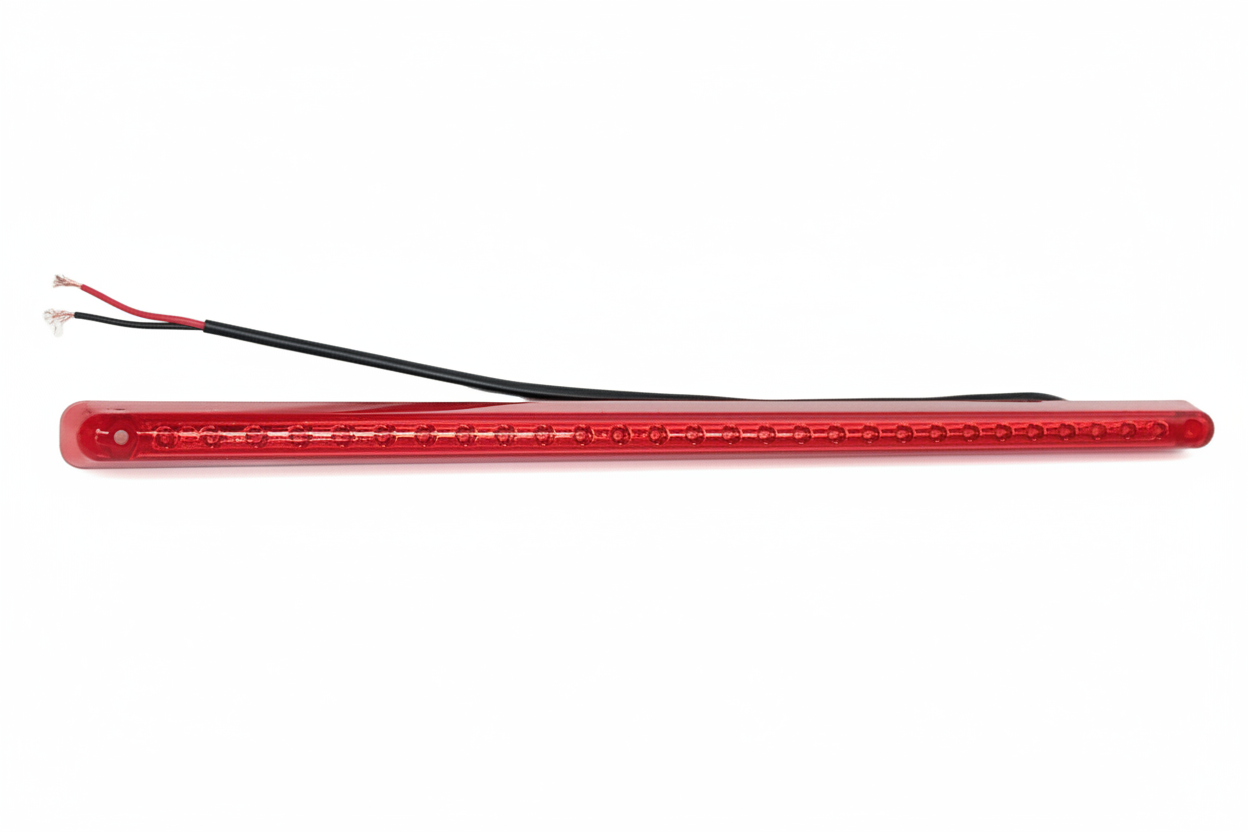 Red LED strip light with black wiring on a white background