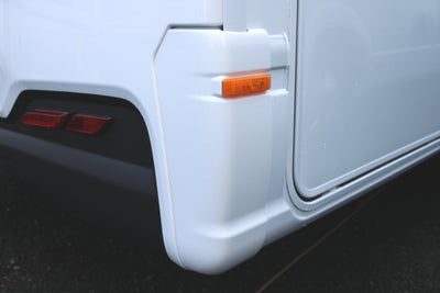 A pair of white Dethleffs Trend motorhome bumper end caps.