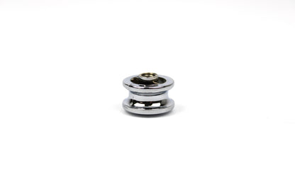 Chrome push button knob on a white background