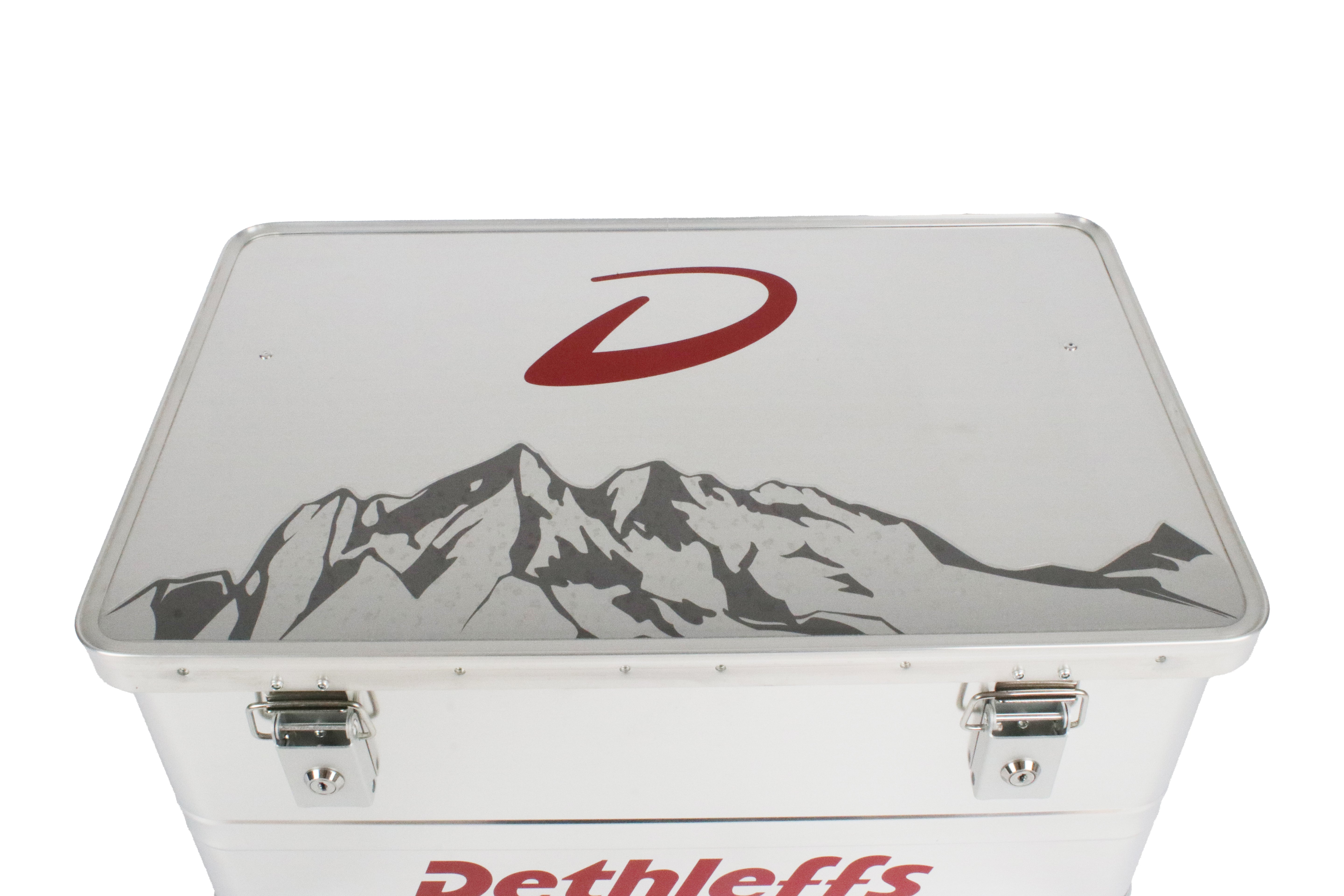 An aluminium Dethleffs motorhome storage box with branded stickers.