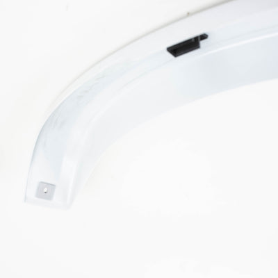 A white Dethleffs motorhome rear wheel arch trim.